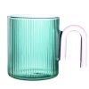 green glass cup with handle